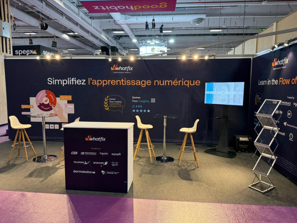 whatfix world of learning summit olympia london exhibition stand expositionists 2